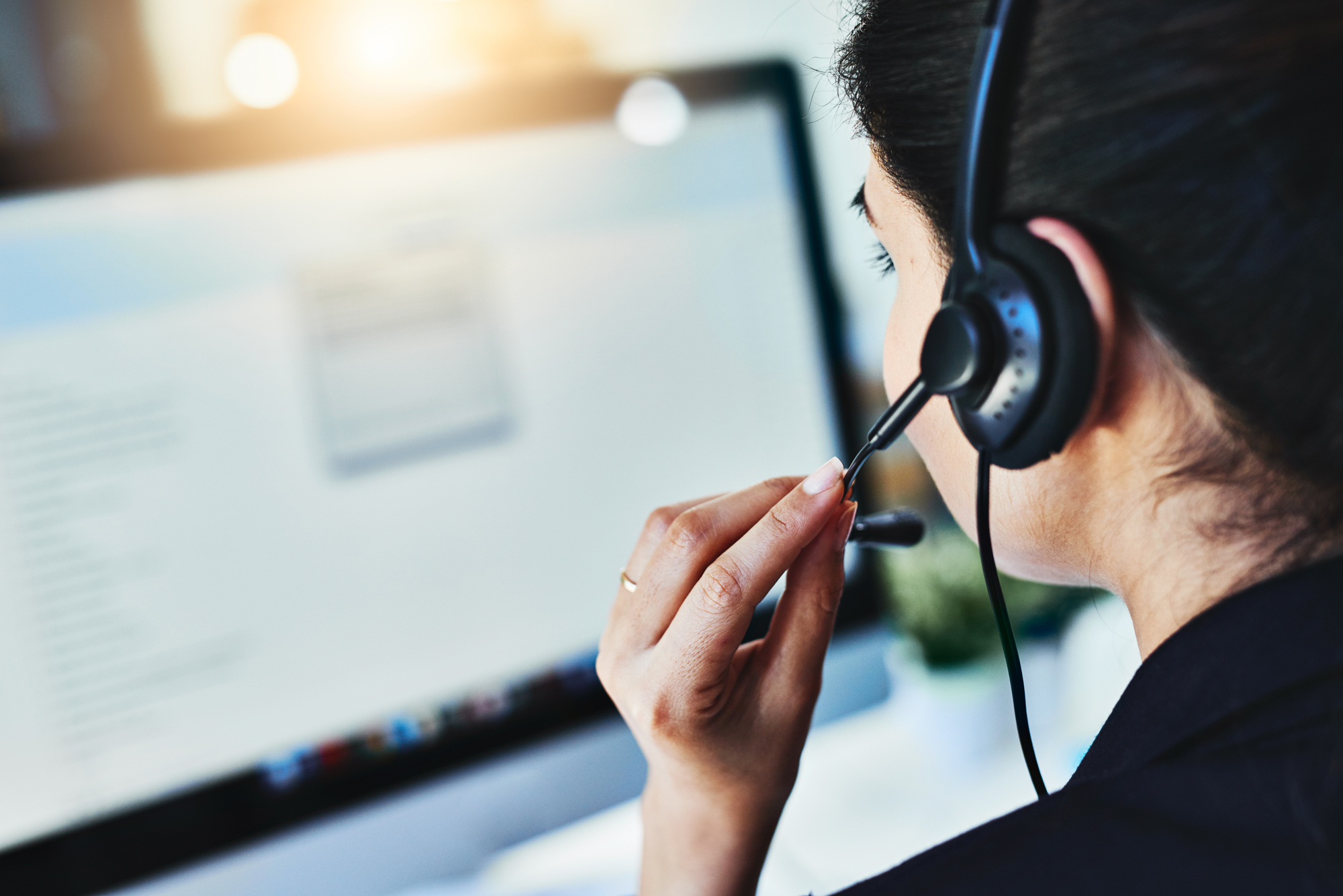 a person in charge of support with headphones on